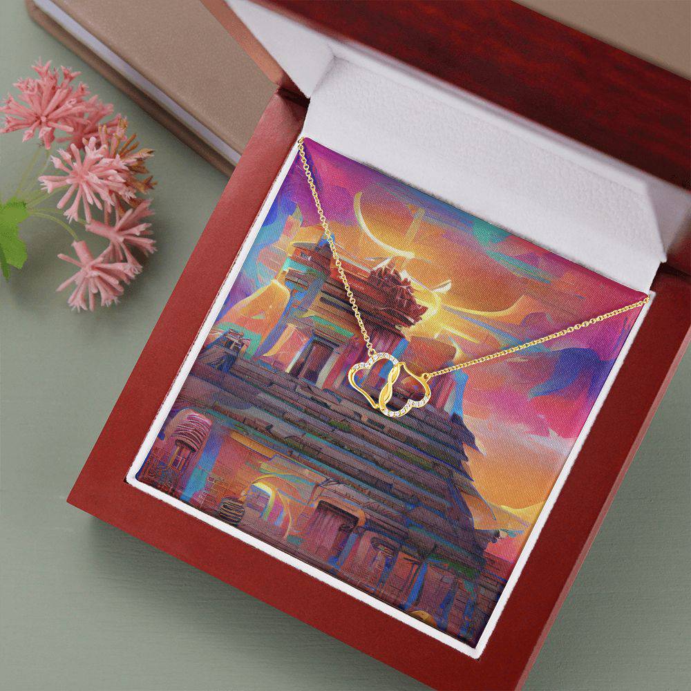 Everlasting Heart necklace featuring two interconnected 10K solid yellow gold hearts adorned with 18 pave set diamonds, displayed in a luxurious mahogany gift box.