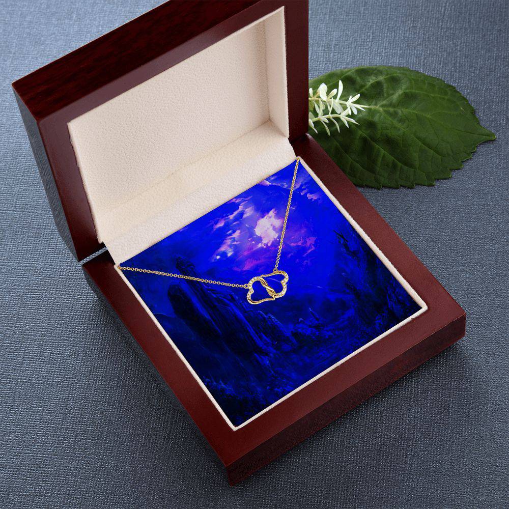 Everlasting Love necklace featuring two connected 10K gold hearts with diamonds, displayed in a luxurious mahogany gift box with LED light.