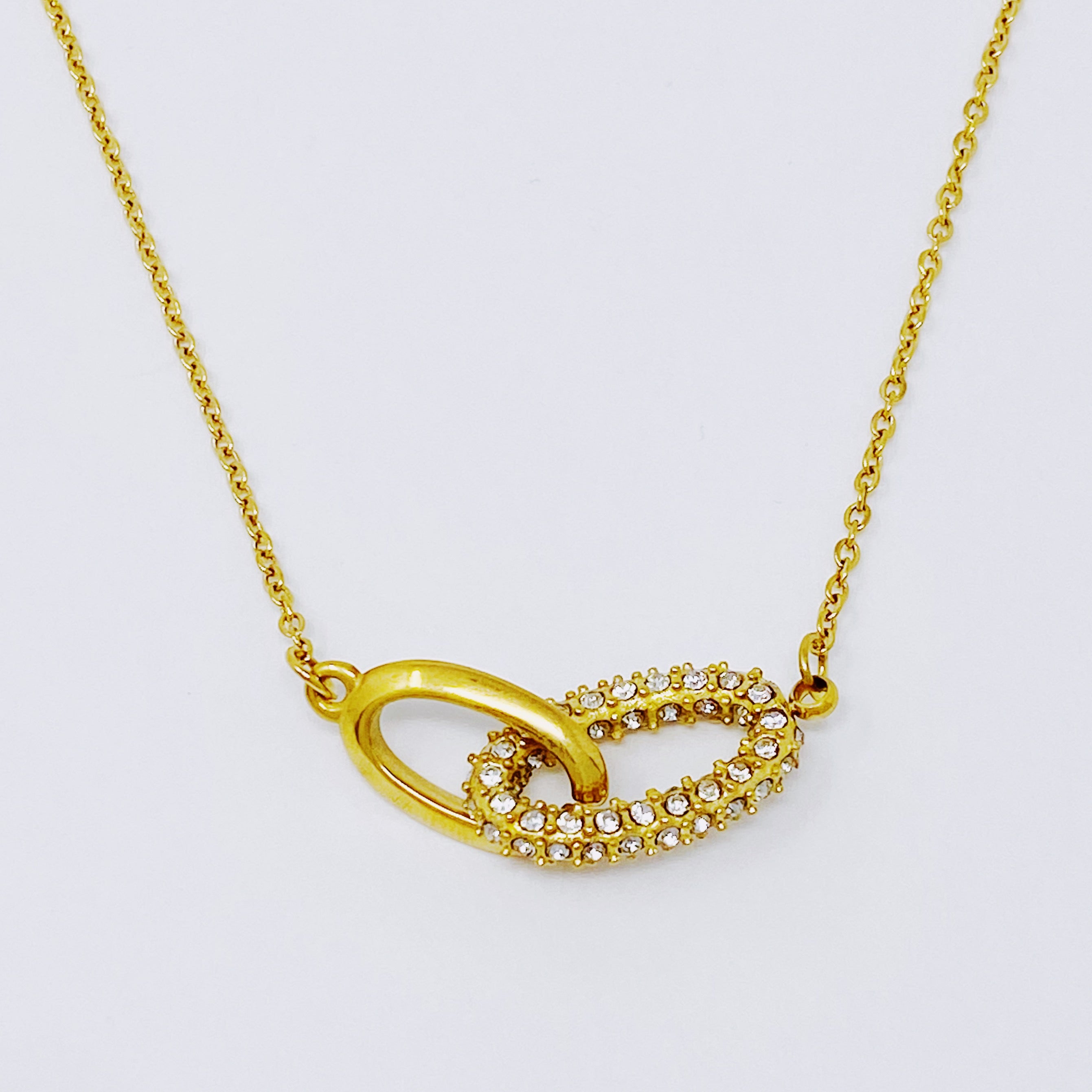 Everly Together Linked Necklace featuring a two-part pendant, 18k gold plating, and sparkling Cubic Zirconia.