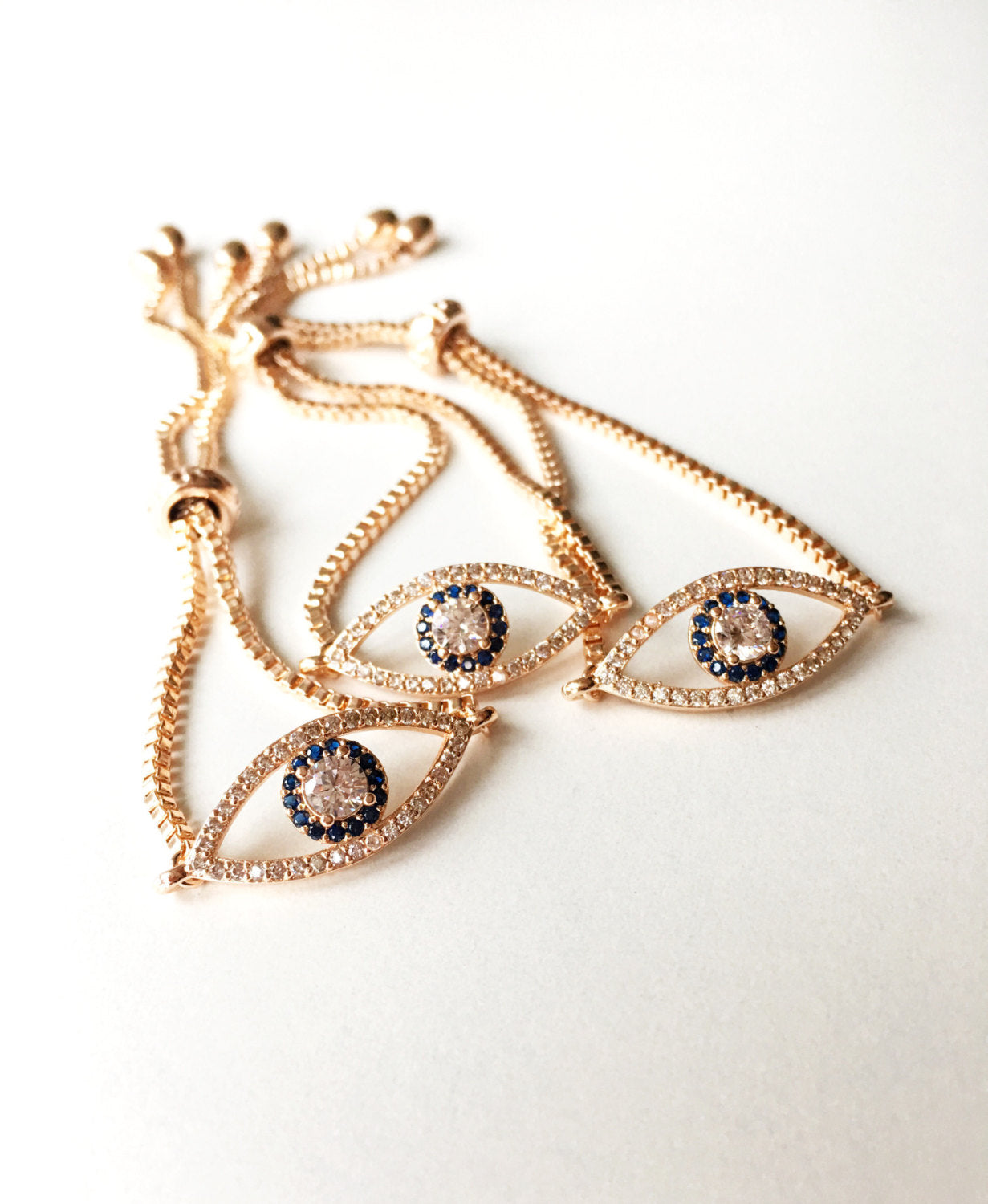 Evil Eye Adjustable Bracelet in rose gold with zirconia stones, showcasing its elegant design and adjustable feature.