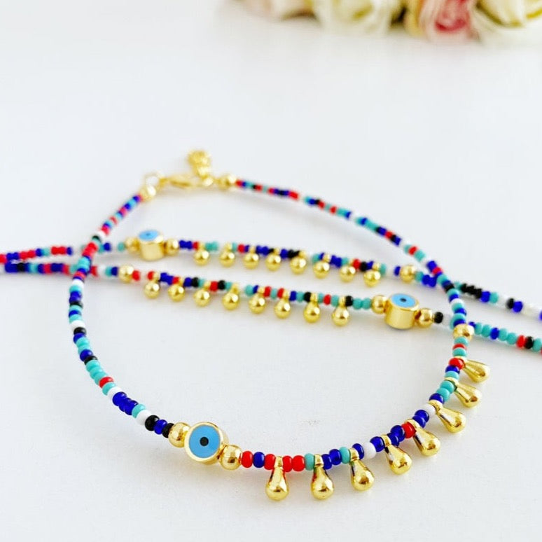 Colorful Evil Eye Anklet made with seed beads, featuring a protective charm, perfect for beach and boho styles.
