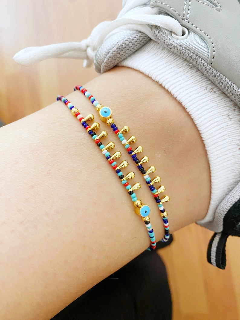 Colorful Evil Eye Anklet made with seed beads, featuring a protective charm, perfect for beach and boho styles.