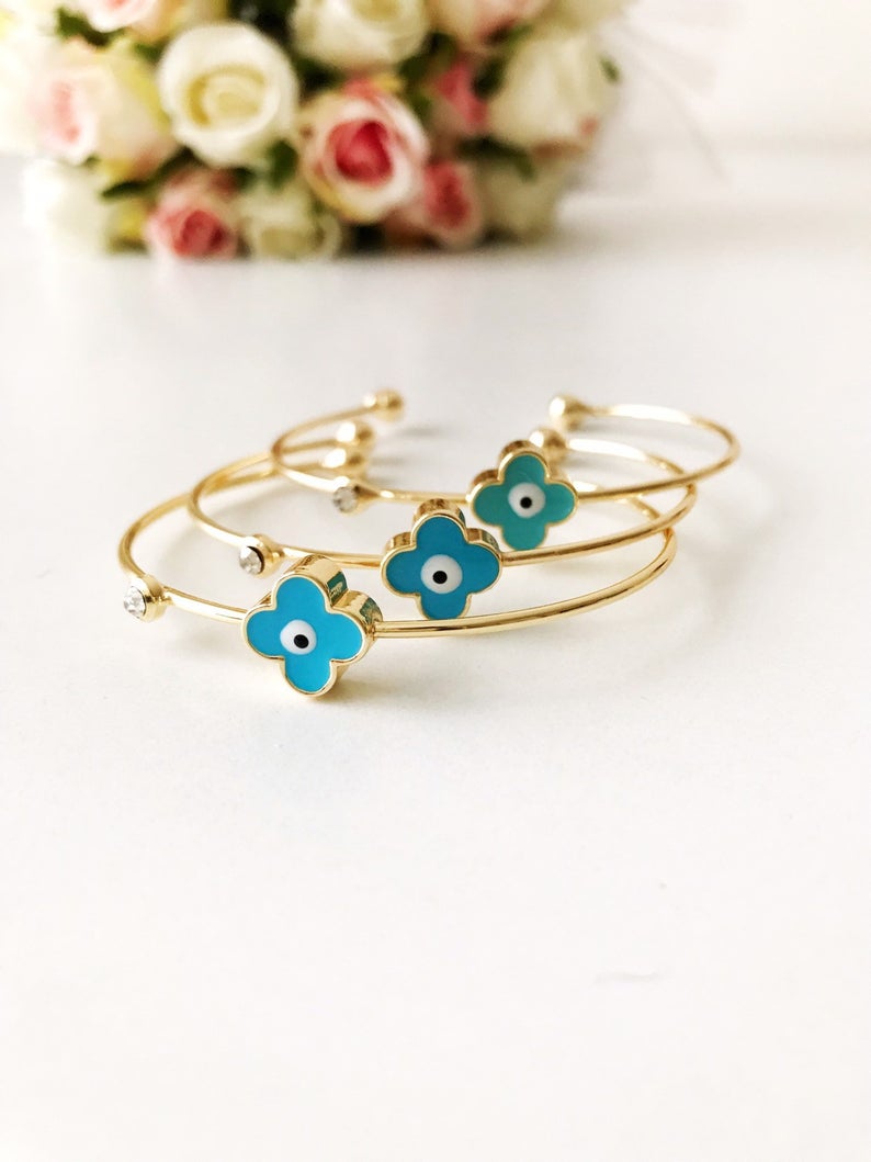 A beautifully crafted Evil Eye Bangle Bracelet featuring a movable oval evil eye charm, made from durable stainless steel.