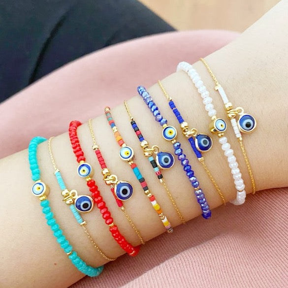 Handmade Evil Eye Bead Bracelet featuring blue, red, and white Miyuki seed beads with an adjustable size and evil eye charm.