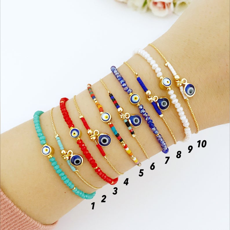 Handmade Evil Eye Bead Bracelet featuring blue, red, and white Miyuki seed beads with an adjustable size and evil eye charm.