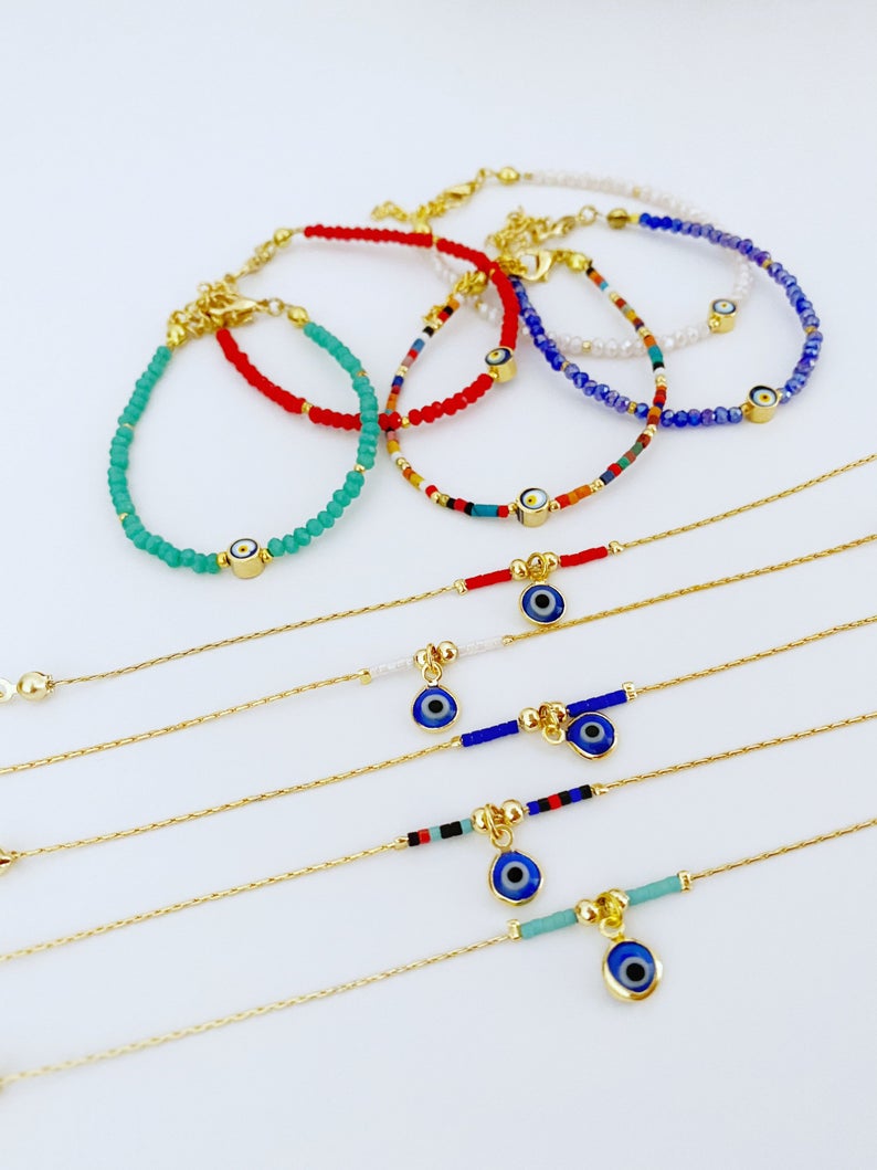 Handmade Evil Eye Bead Bracelet featuring blue, red, and white Miyuki seed beads with an adjustable size and evil eye charm.