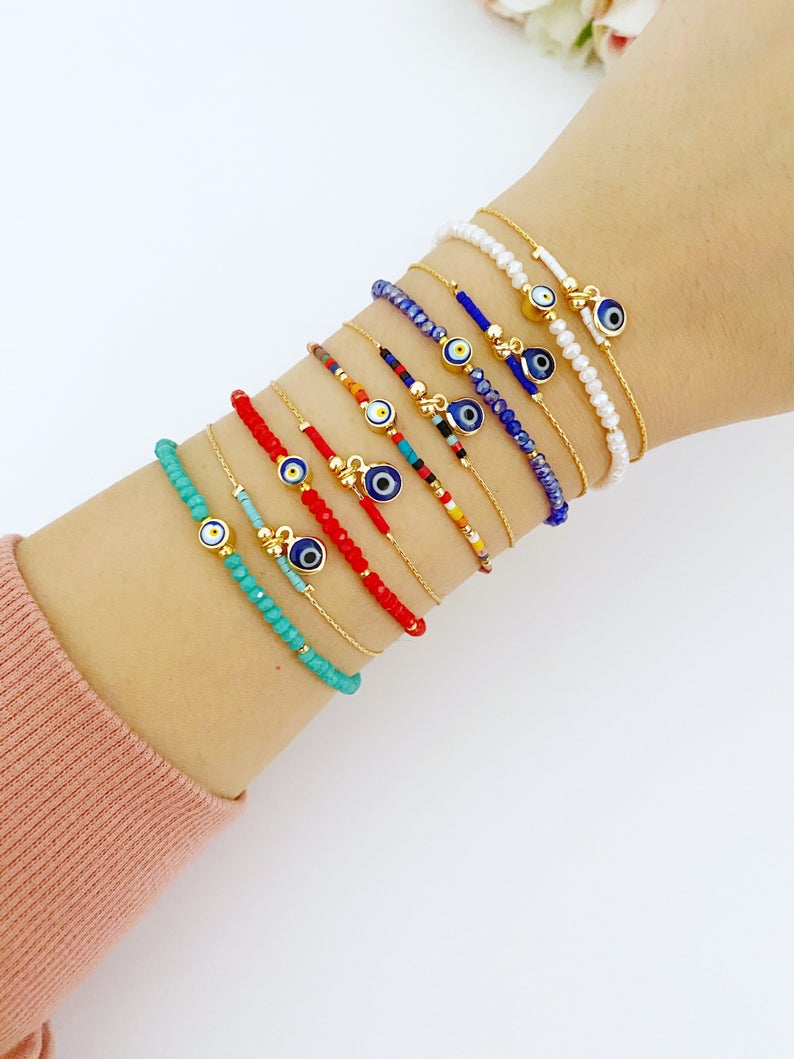 Handmade Evil Eye Bead Bracelet featuring blue, red, and white Miyuki seed beads with an adjustable size and evil eye charm.