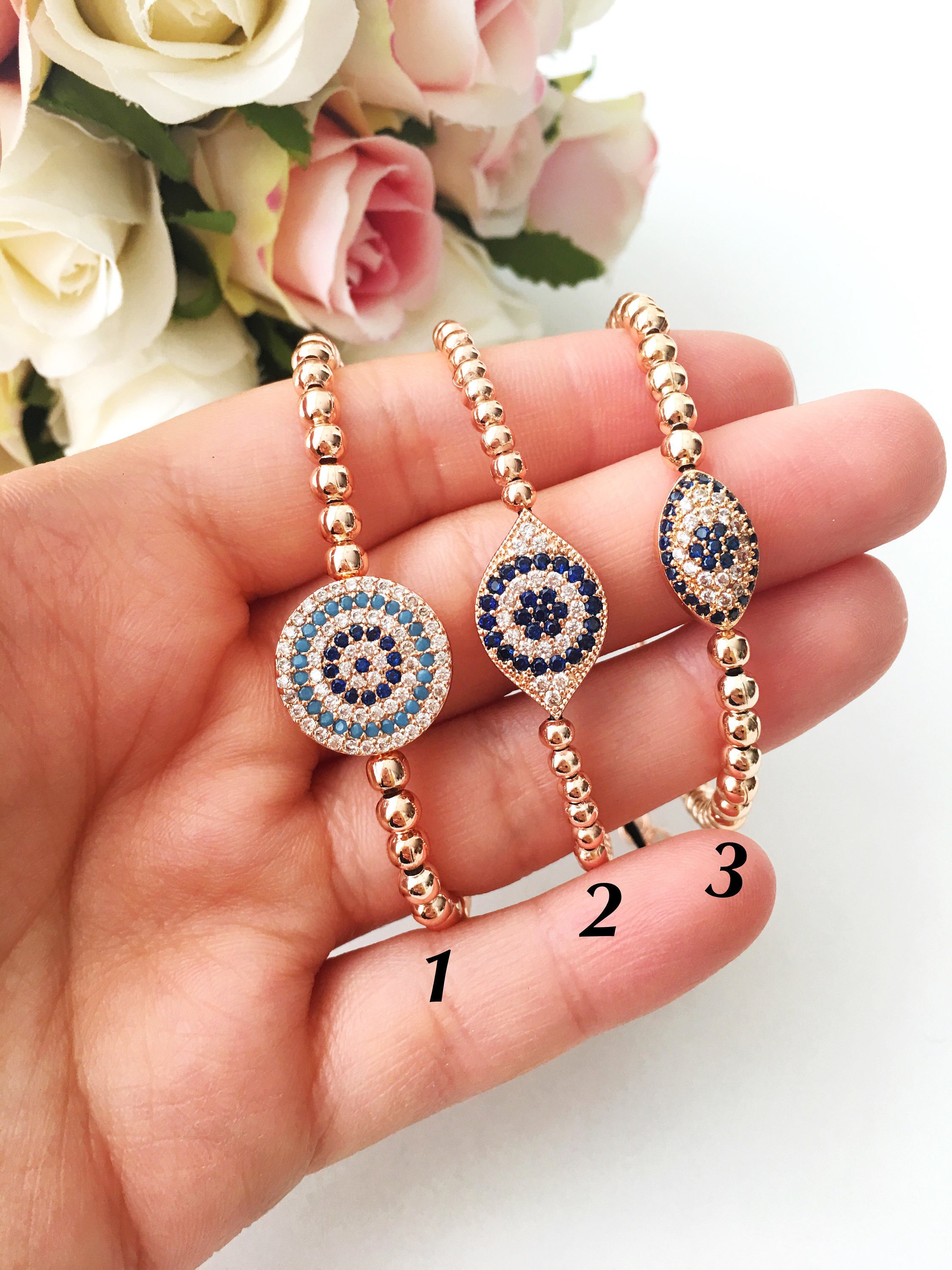Elegant rose gold adjustable Evil Eye Beaded Bracelet featuring zirconia stones, handmade from tarnish-resistant stainless steel.
