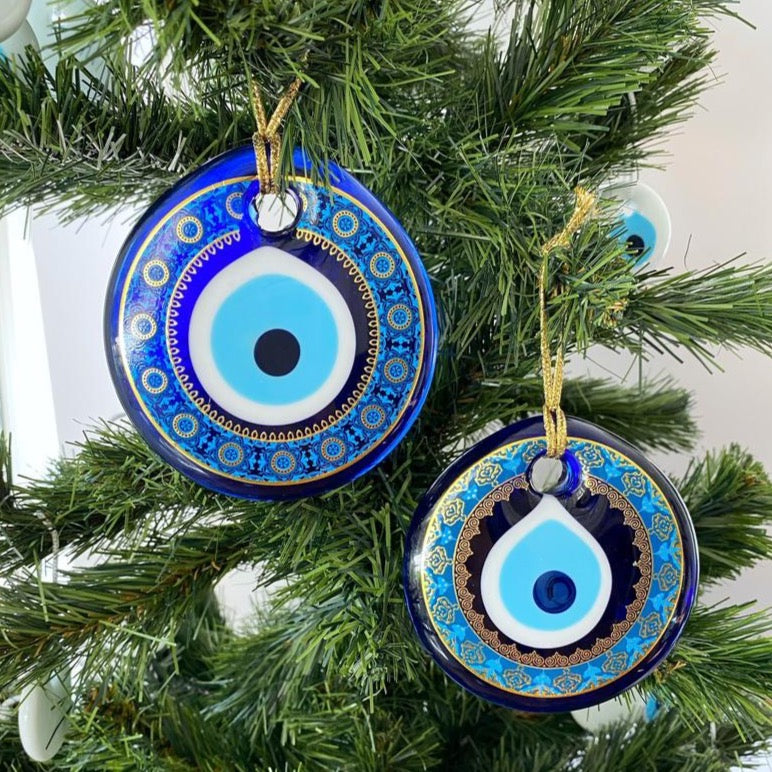 A collection of blue glass evil eye beads, featuring intricate patterns, perfect for Christmas tree decoration and wall hanging.