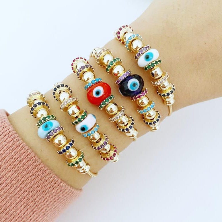 A beautiful Evil Eye Bracelet featuring a colorful glass charm and adjustable stainless steel design, perfect for everyday wear and protection.