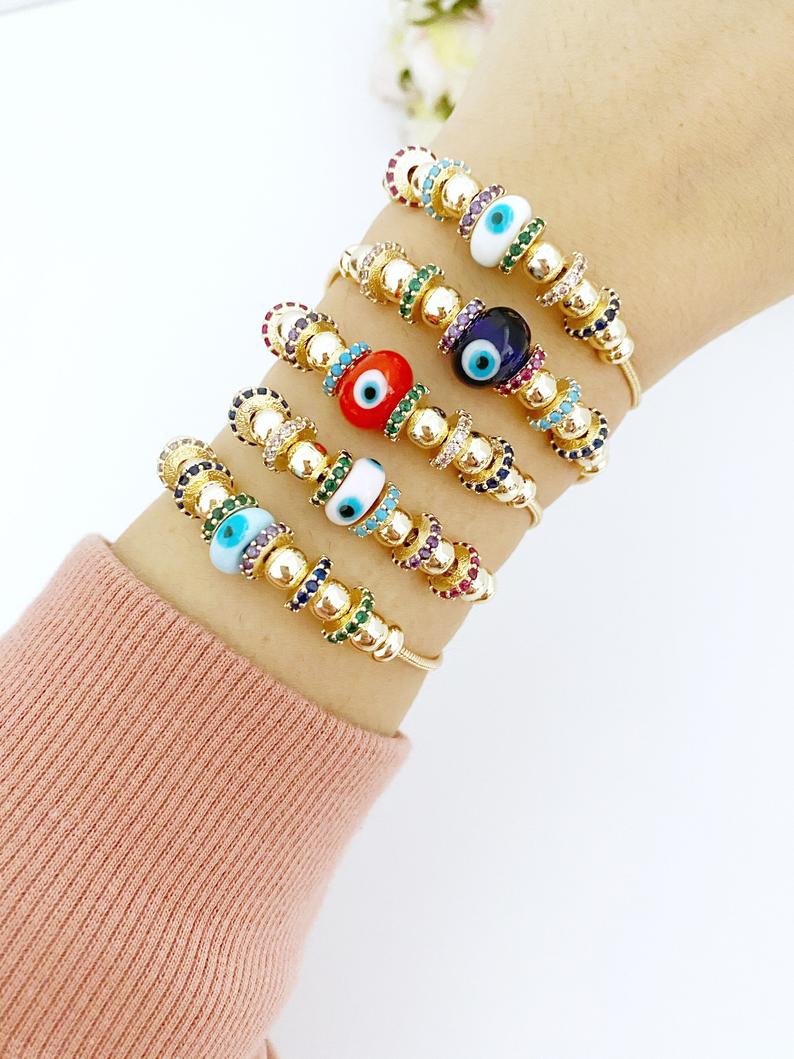 A beautiful Evil Eye Bracelet featuring a colorful glass charm and adjustable stainless steel design, perfect for everyday wear and protection.