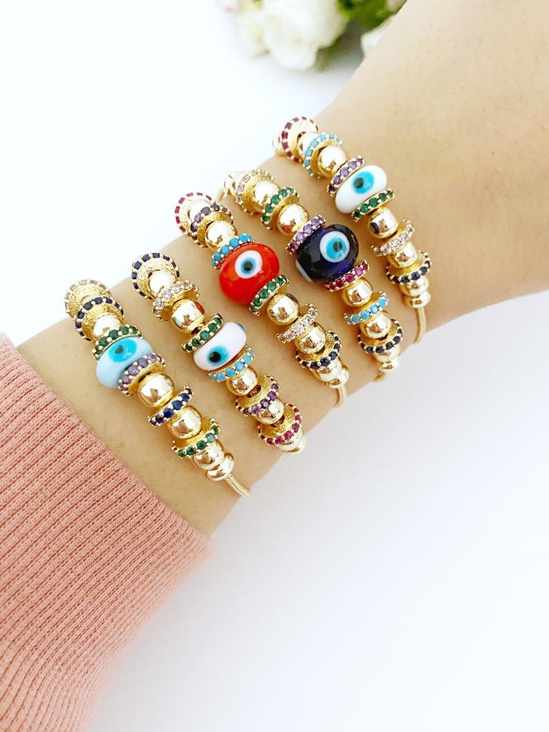 A beautiful Evil Eye Bracelet featuring a colorful glass charm and adjustable stainless steel design, perfect for everyday wear and protection.