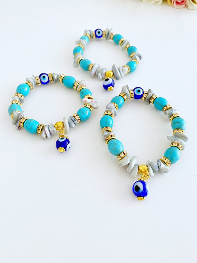 A beautiful Evil Eye Bracelet featuring baroque beads, turquoise beads, and blue glass eye beads, showcasing a boho style.
