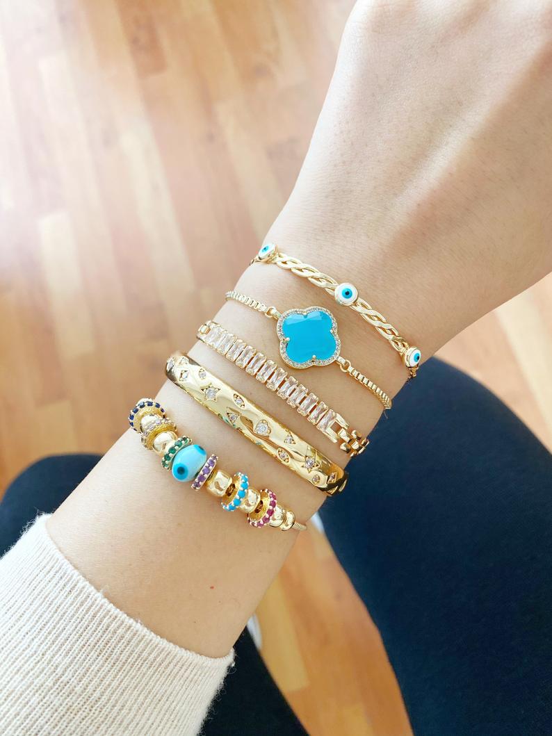 A beautiful handmade Evil Eye Bracelet featuring a blue glass Pandora charm, crafted from tarnish-resistant 316L stainless steel.