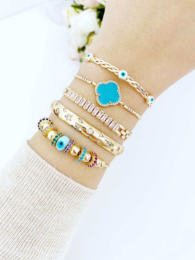 A beautiful handmade Evil Eye Bracelet featuring a blue glass Pandora charm, crafted from tarnish-resistant 316L stainless steel.