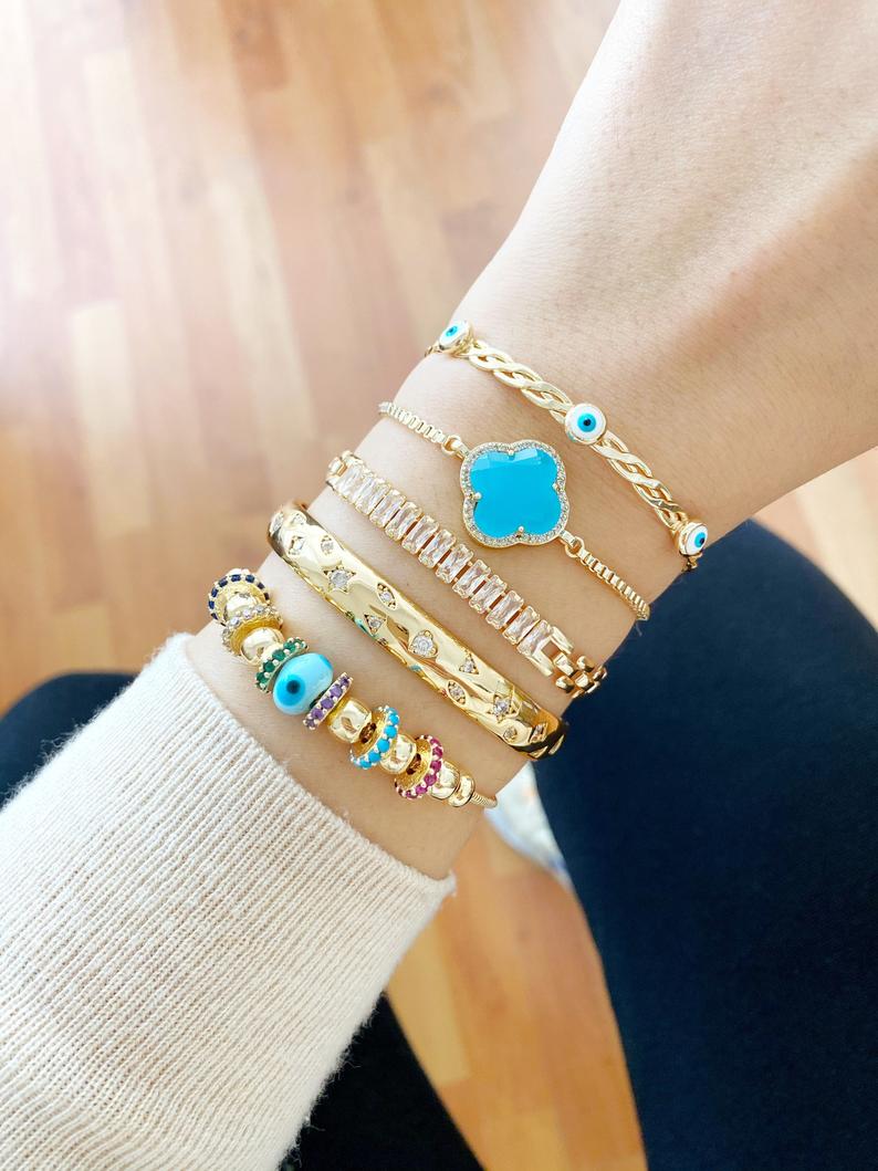 A beautiful handmade Evil Eye Bracelet featuring a blue glass Pandora charm, crafted from tarnish-resistant 316L stainless steel.