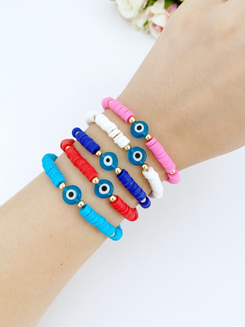 Handmade Evil Eye Bracelet featuring colorful Heishi vinyl polymer clay disc beads, perfect for summer stacking.
