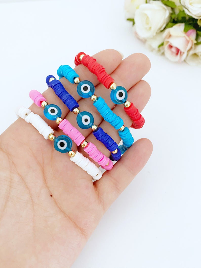 Handmade Evil Eye Bracelet featuring colorful Heishi vinyl polymer clay disc beads, perfect for summer stacking.