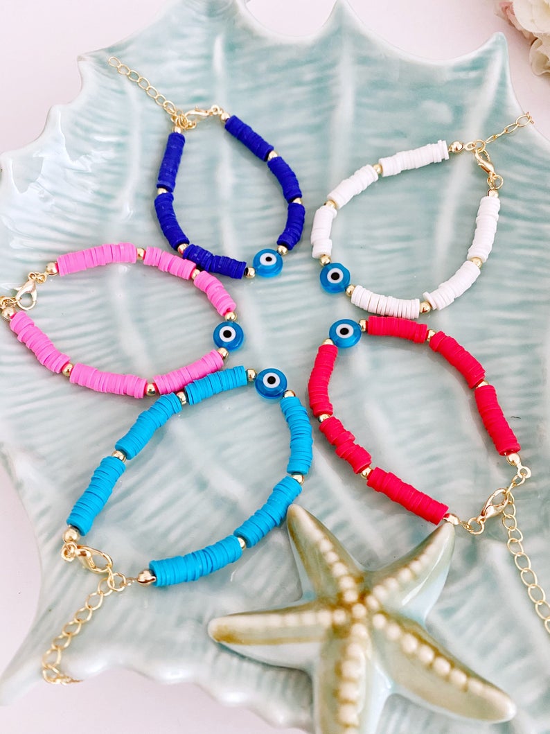 Handmade Evil Eye Bracelet featuring colorful Heishi vinyl polymer clay disc beads, perfect for summer stacking.