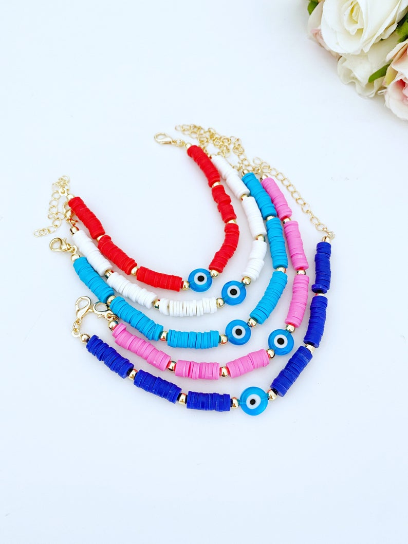 Handmade Evil Eye Bracelet featuring colorful Heishi vinyl polymer clay disc beads, perfect for summer stacking.