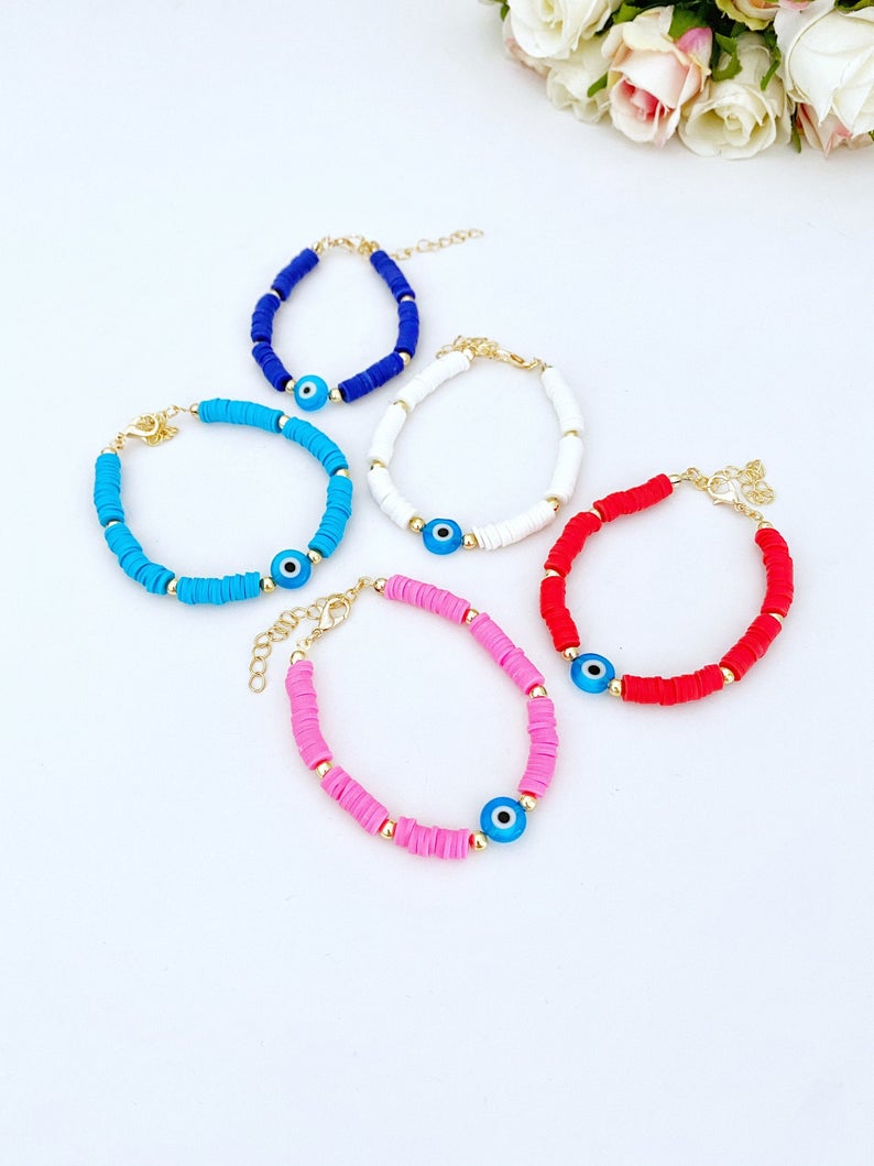 Handmade Evil Eye Bracelet featuring colorful Heishi vinyl polymer clay disc beads, perfect for summer stacking.