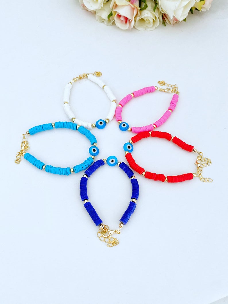 Handmade Evil Eye Bracelet featuring colorful Heishi vinyl polymer clay disc beads, perfect for summer stacking.