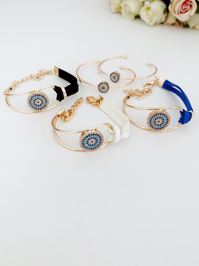Evil Eye Bracelet featuring a leather band and rose gold chain, adorned with a protective evil eye charm and zircon stones.