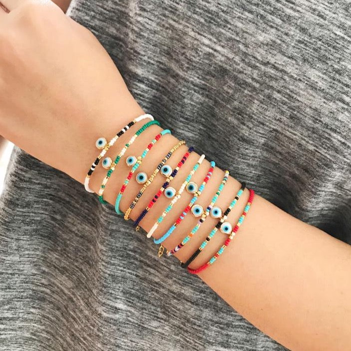 Handmade Evil Eye Bracelet featuring colorful seed beads and a blue evil eye bead, symbolizing luck and protection.
