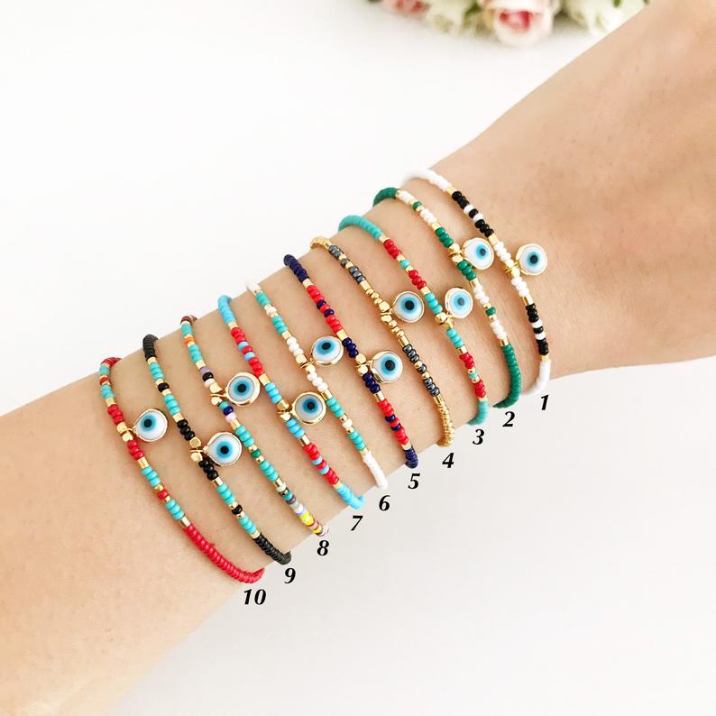 Handmade Evil Eye Bracelet featuring colorful seed beads and a blue evil eye bead, symbolizing luck and protection.