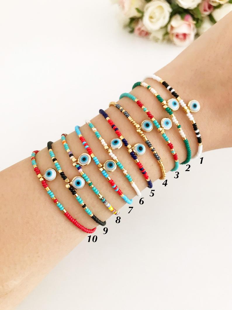 Handmade Evil Eye Bracelet featuring colorful seed beads and a blue evil eye bead, symbolizing luck and protection.