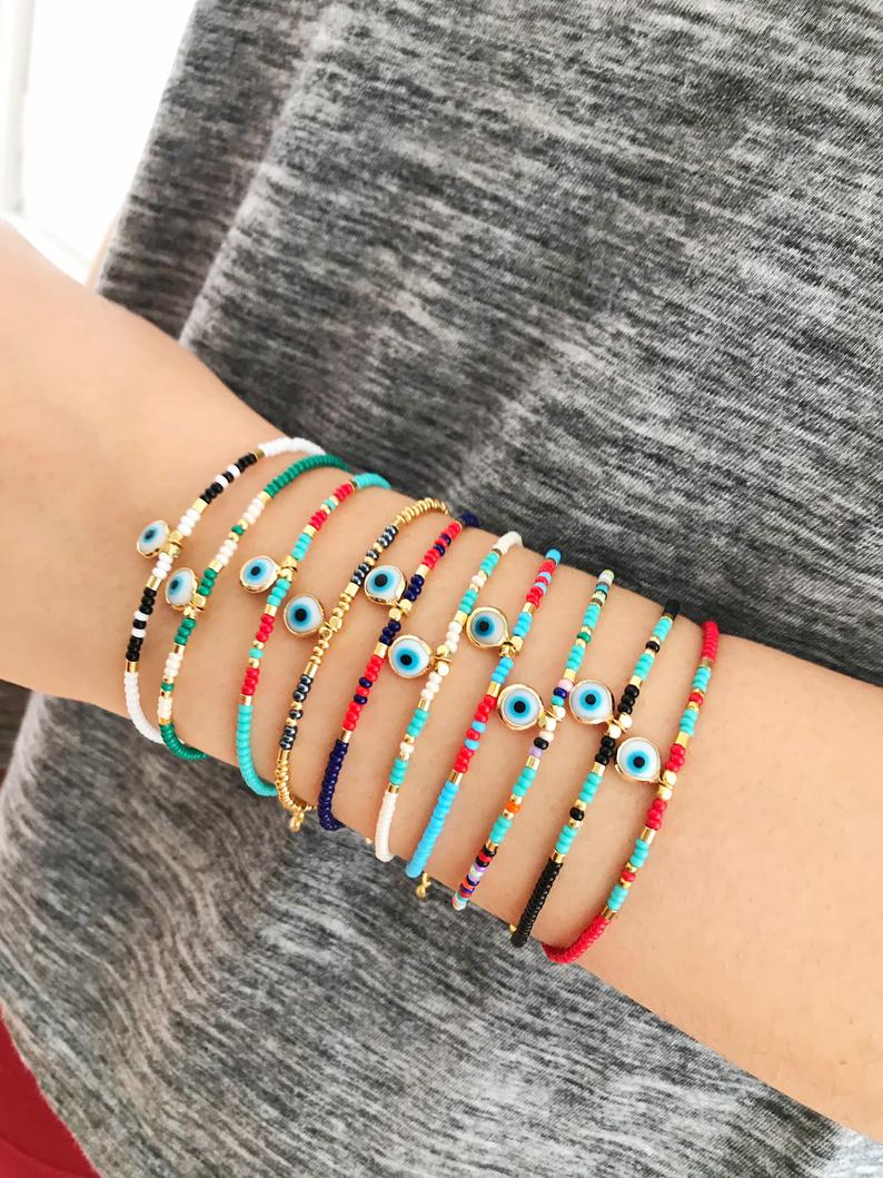 Handmade Evil Eye Bracelet featuring colorful seed beads and a blue evil eye bead, symbolizing luck and protection.