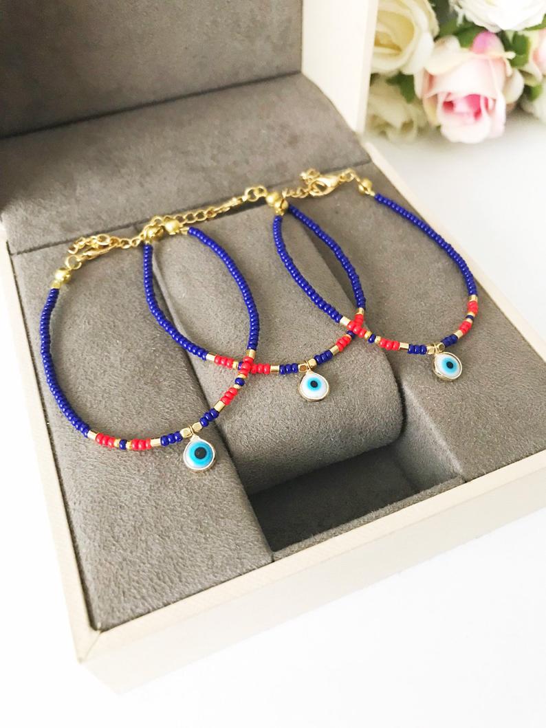 Handmade Evil Eye Bracelet featuring colorful seed beads and a blue evil eye bead, symbolizing luck and protection.