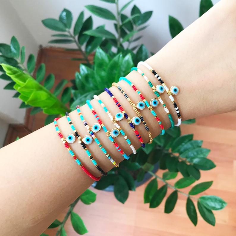 Handmade Evil Eye Bracelet featuring colorful seed beads and a blue evil eye bead, symbolizing luck and protection.