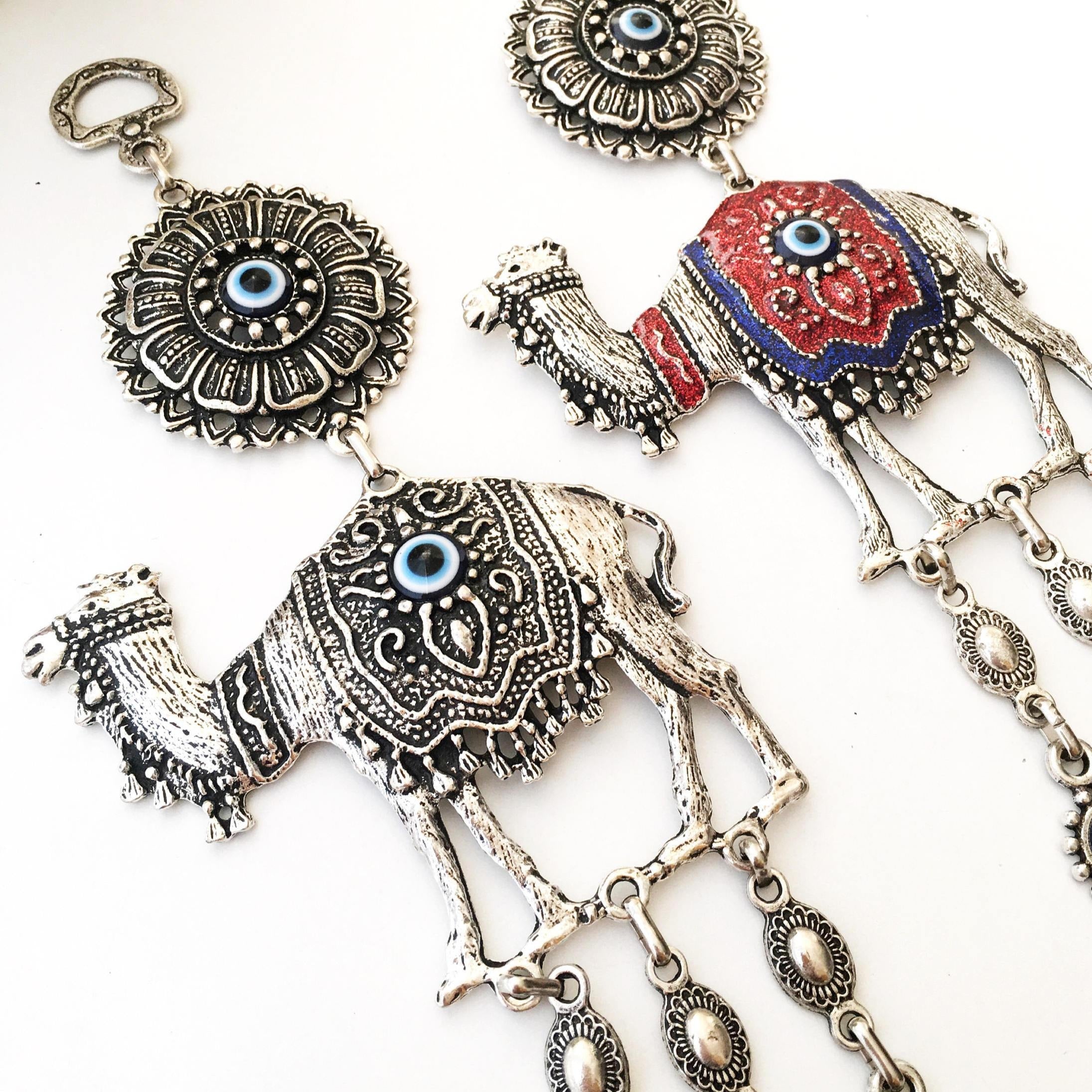 Handmade Evil Eye Camel Wall Hanging featuring traditional Turkish evil eye design in silver and red colors, symbolizing protection and good luck.