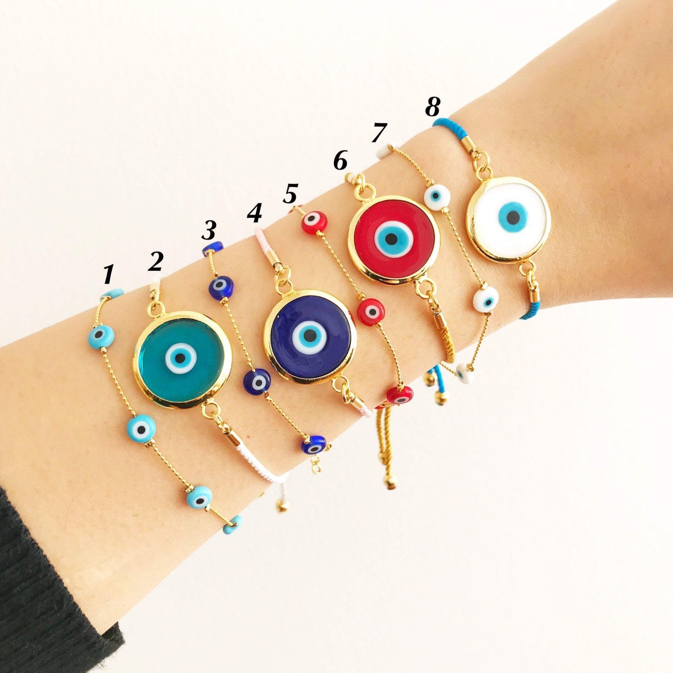 A beautifully crafted Evil Eye Chain Bracelet featuring a Murano glass bead, adjustable corton cord, and tarnish-resistant stainless steel.