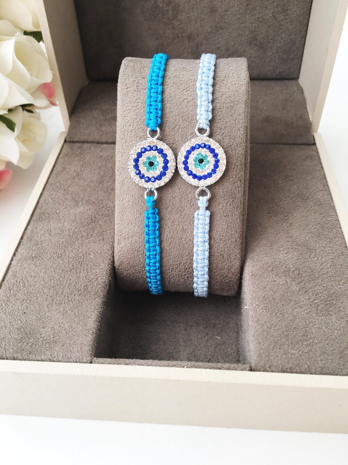 Handmade Evil Eye Charm Bracelet featuring blue macrame and zircon charm, symbolizing protection and style.