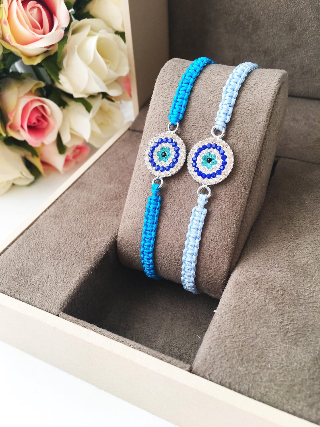 Handmade Evil Eye Charm Bracelet featuring blue macrame and zircon charm, symbolizing protection and style.