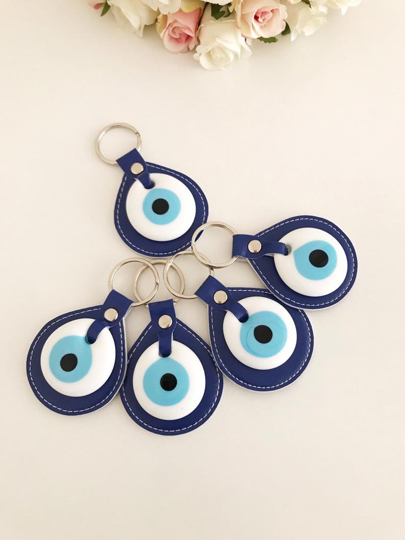 Evil eye elegant leather keychain in various colors, featuring a glass evil eye charm.
