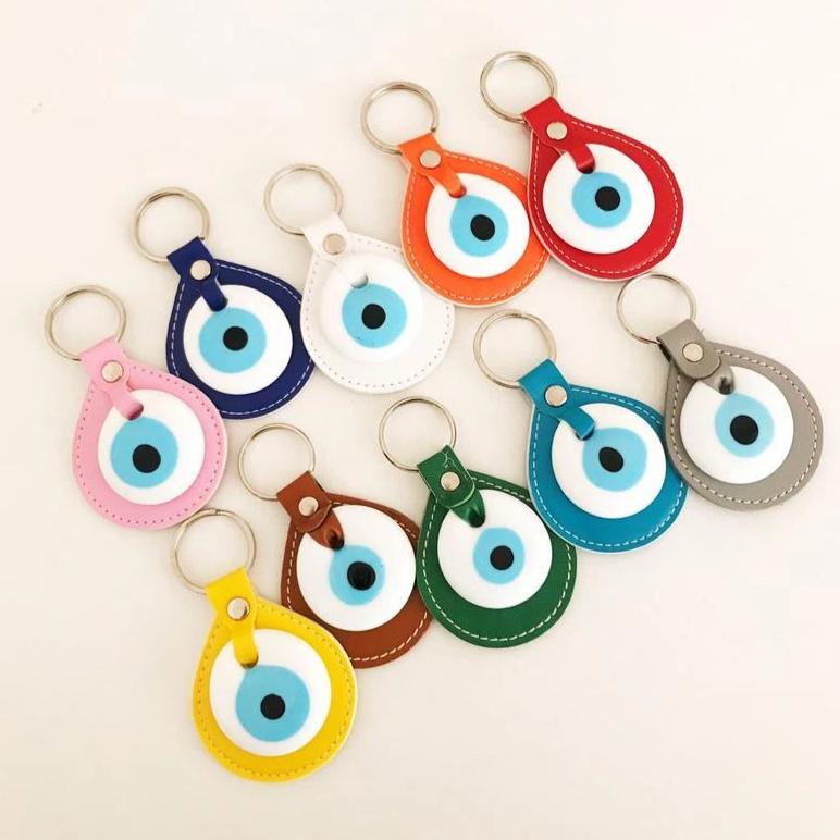Evil eye elegant leather keychain in various colors, featuring a glass evil eye charm.