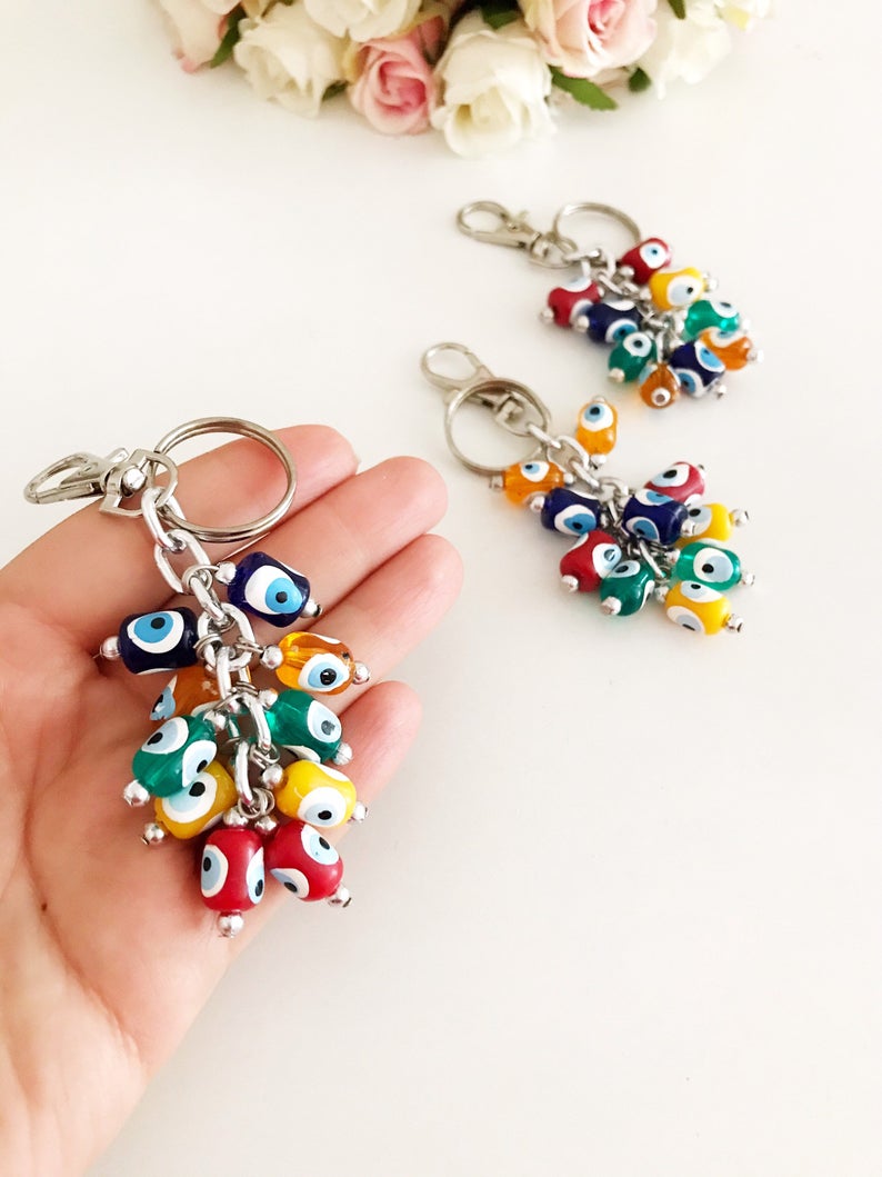Colorful Evil Eye Keychain featuring vibrant resin beads and durable enamel material, symbolizing protection and luck.