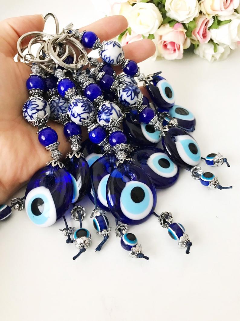 Evil eye protection keychain featuring a ceramic charm, vibrant colors, and intricate design, perfect for keys or bags.
