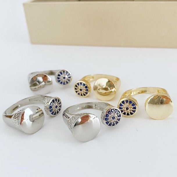 A beautiful adjustable Evil Eye Ring featuring a zircon evil eye bead on a gold or silver band, perfect for boho style.