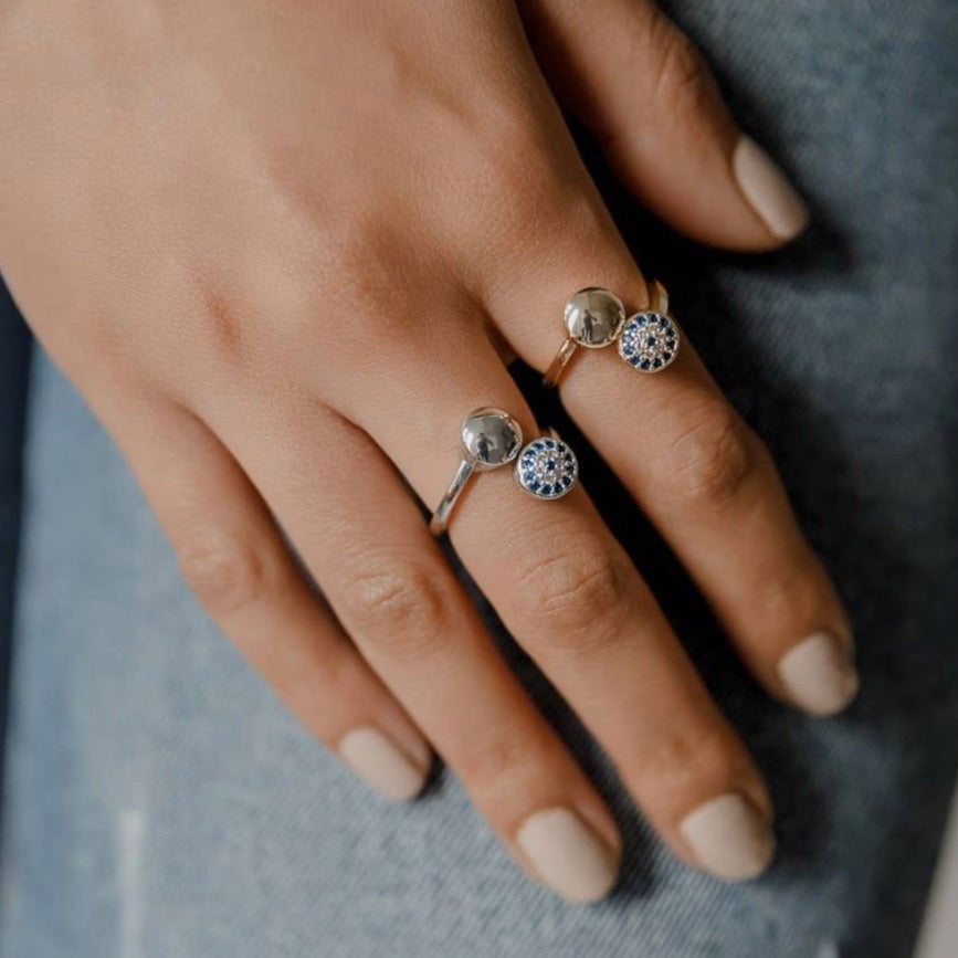 Adjustable Evil Eye Ring featuring a zircon charm on a gold or silver band, showcasing a protective symbol in a stylish design.