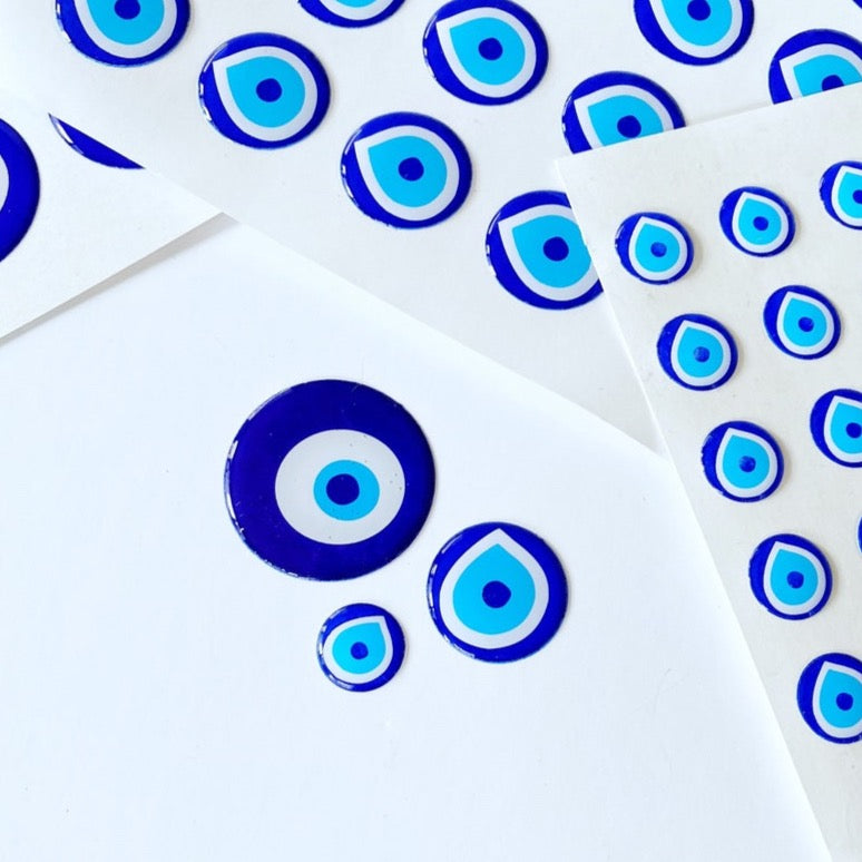 Evil Eye Sticker Pack featuring various sizes of embossed Turkish Evil Eye stickers on a colorful background.