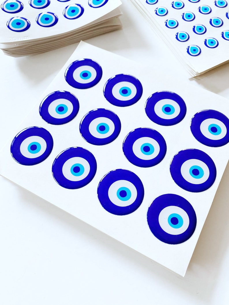 Evil Eye Sticker Pack featuring various sizes of embossed Turkish Evil Eye stickers on a colorful background.