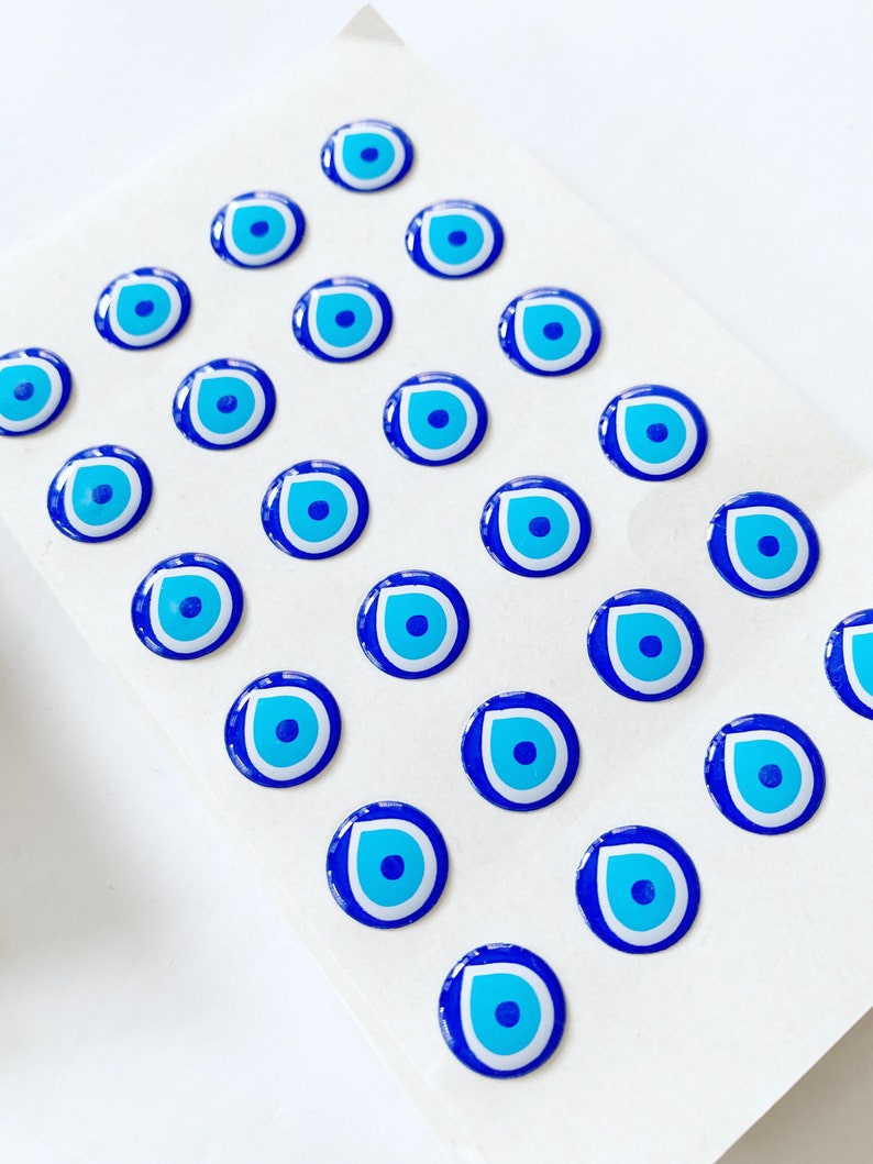 Evil Eye Sticker Pack featuring various sizes of embossed Turkish Evil Eye stickers on a colorful background.