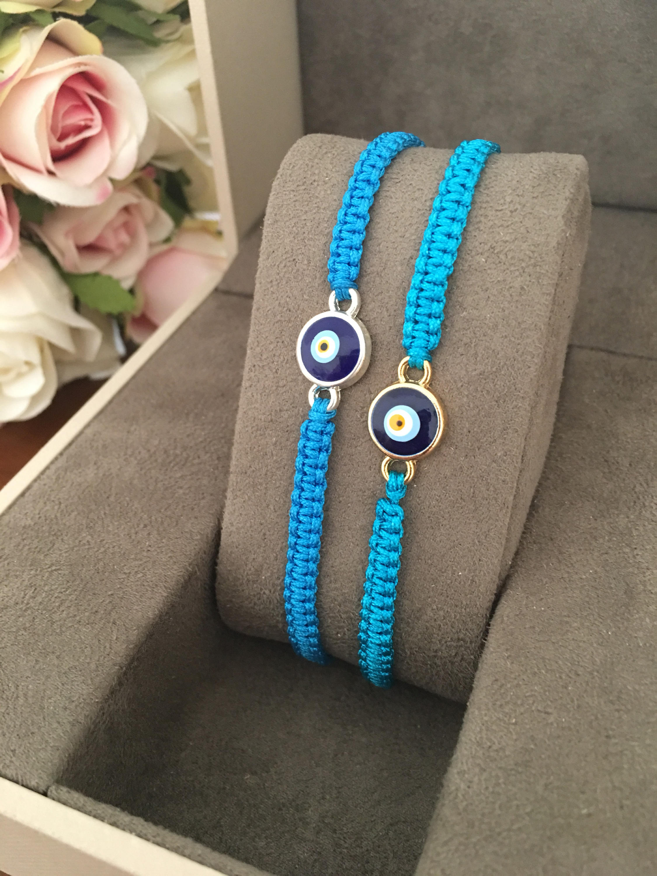 Handmade Evil Eye String Bracelet featuring turquoise macrame and an adjustable design with a protective charm.