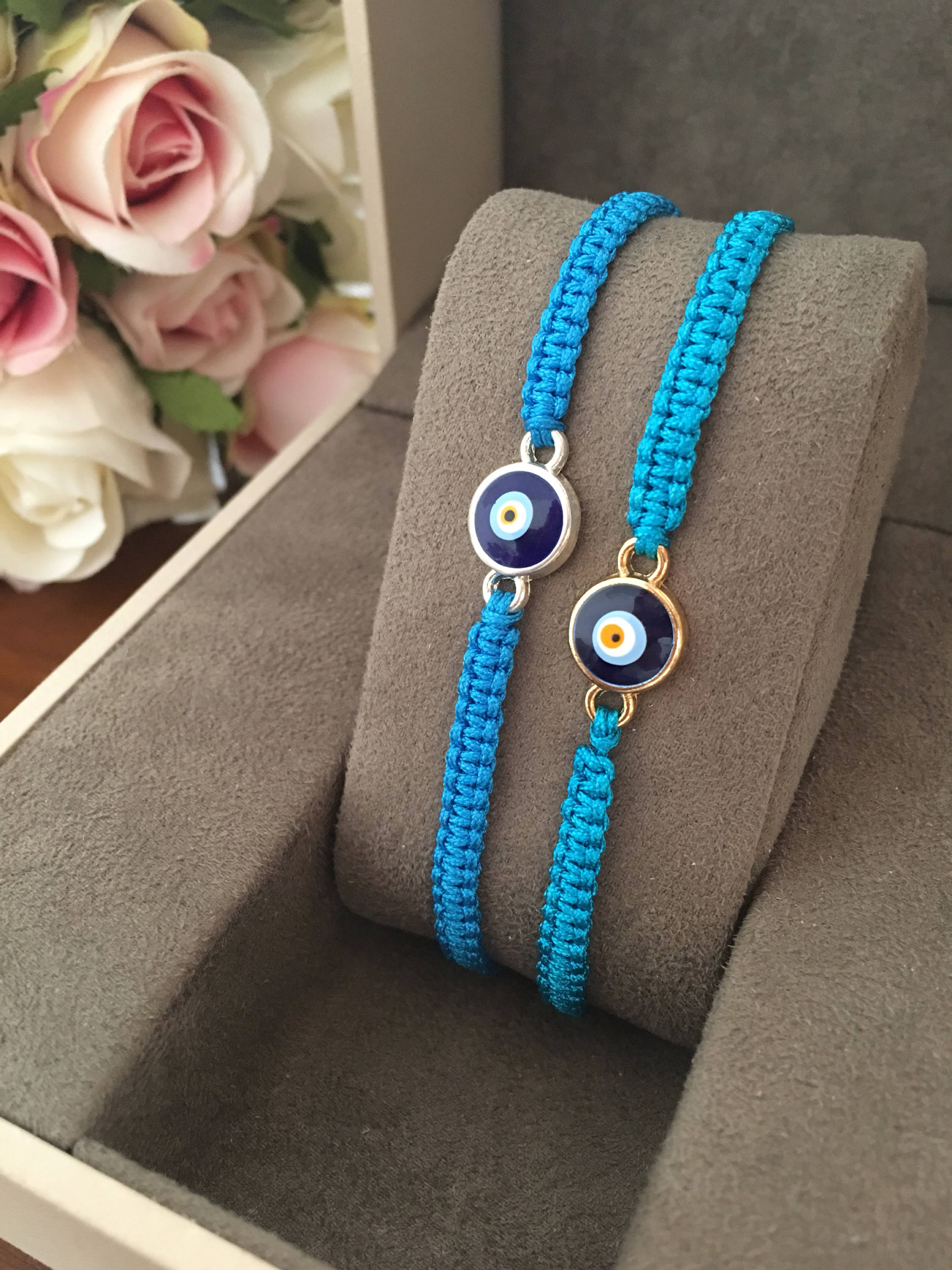 Handmade Evil Eye String Bracelet featuring turquoise macrame and an adjustable design with a protective charm.