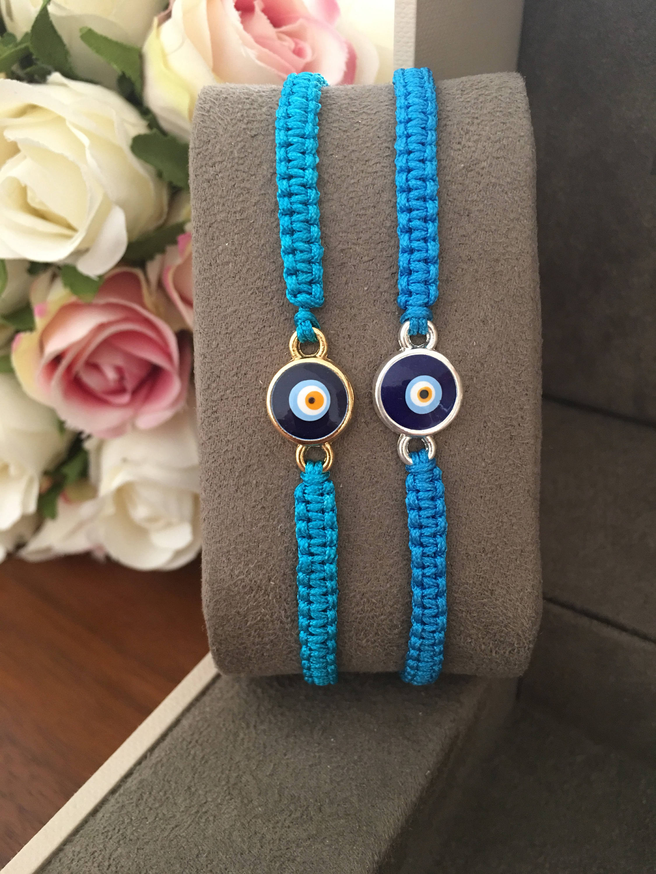 Handmade Evil Eye String Bracelet featuring turquoise macrame and an adjustable design with a protective charm.