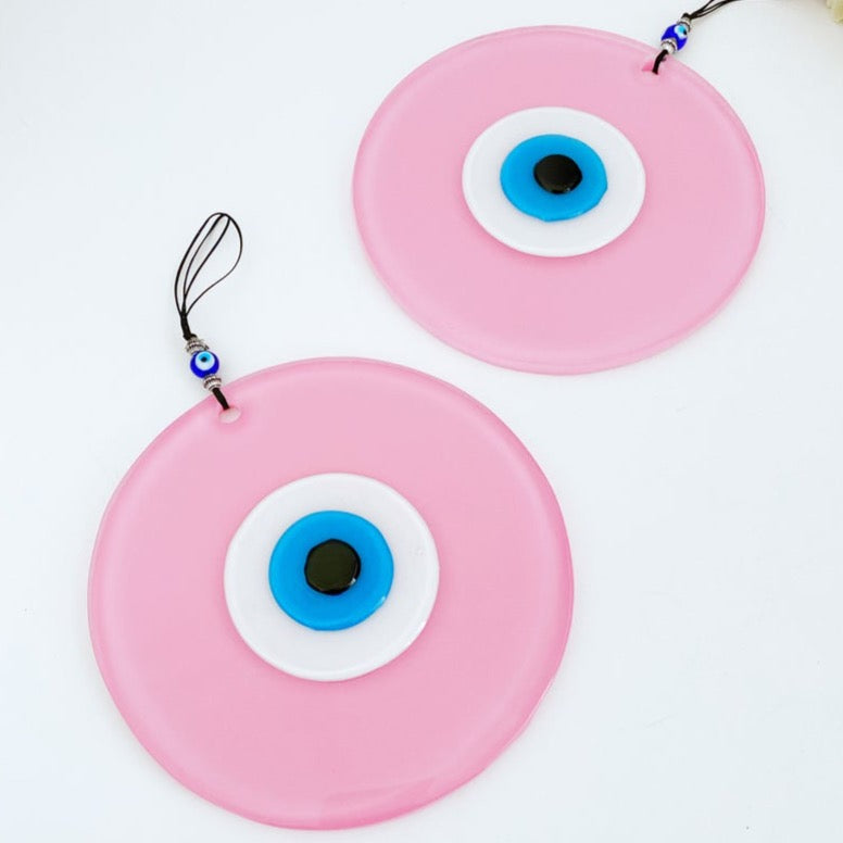 Handmade Pink Evil Eye Wall Decor featuring unique glass beads, perfect for baby room and Turkish decor.